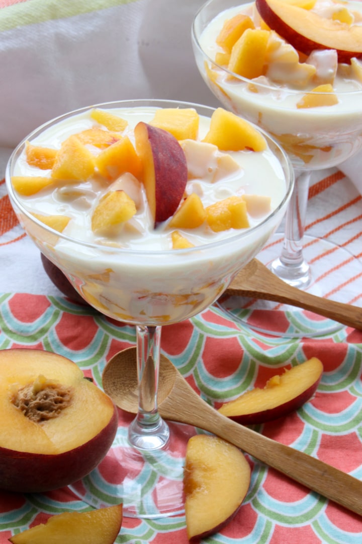 dessert dish with fresh peaches and cream