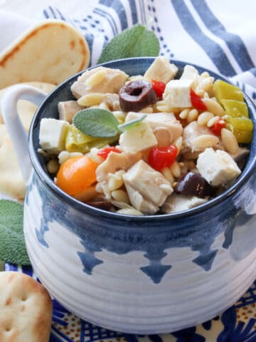 BLUE AND WHITE BOWL FILLED WITH GREEK ORZO PASTA SALAD