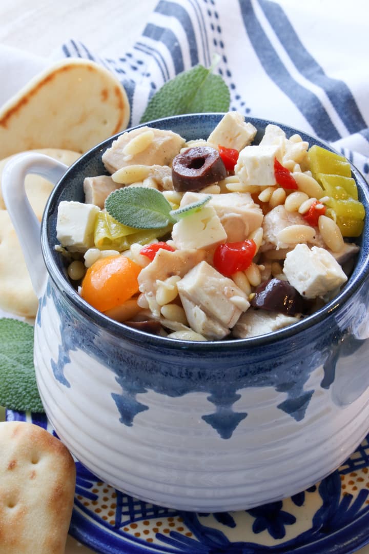 BLUE AND WHITE BOWL FILLED WITH GREEK ORZO PASTA SALAD