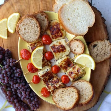 board with grilled bread cheese and tomatoes