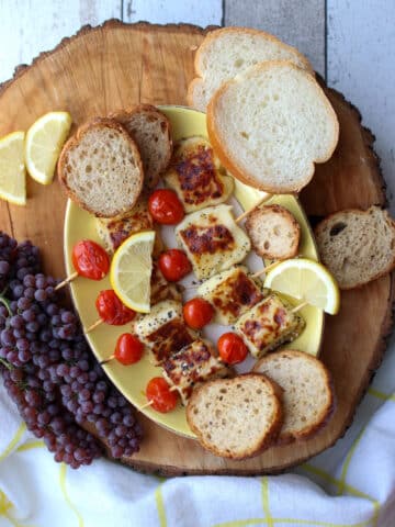 board with grilled bread cheese and tomatoes