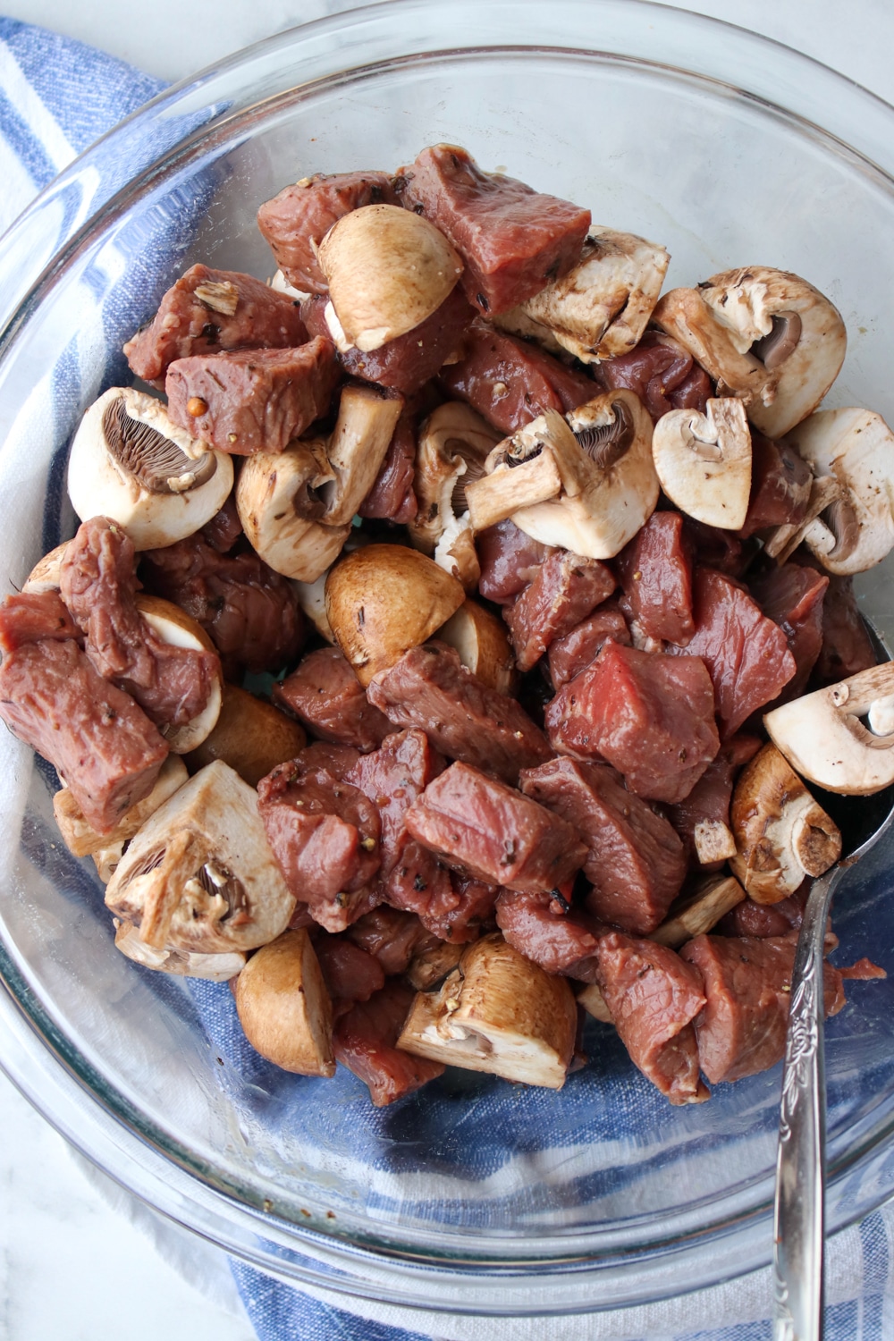 bowl with cut up steak and mushrooms