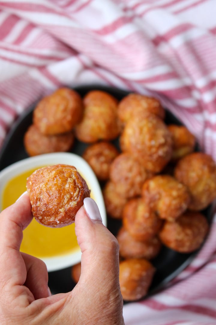 hand holding 1 pretzel bite