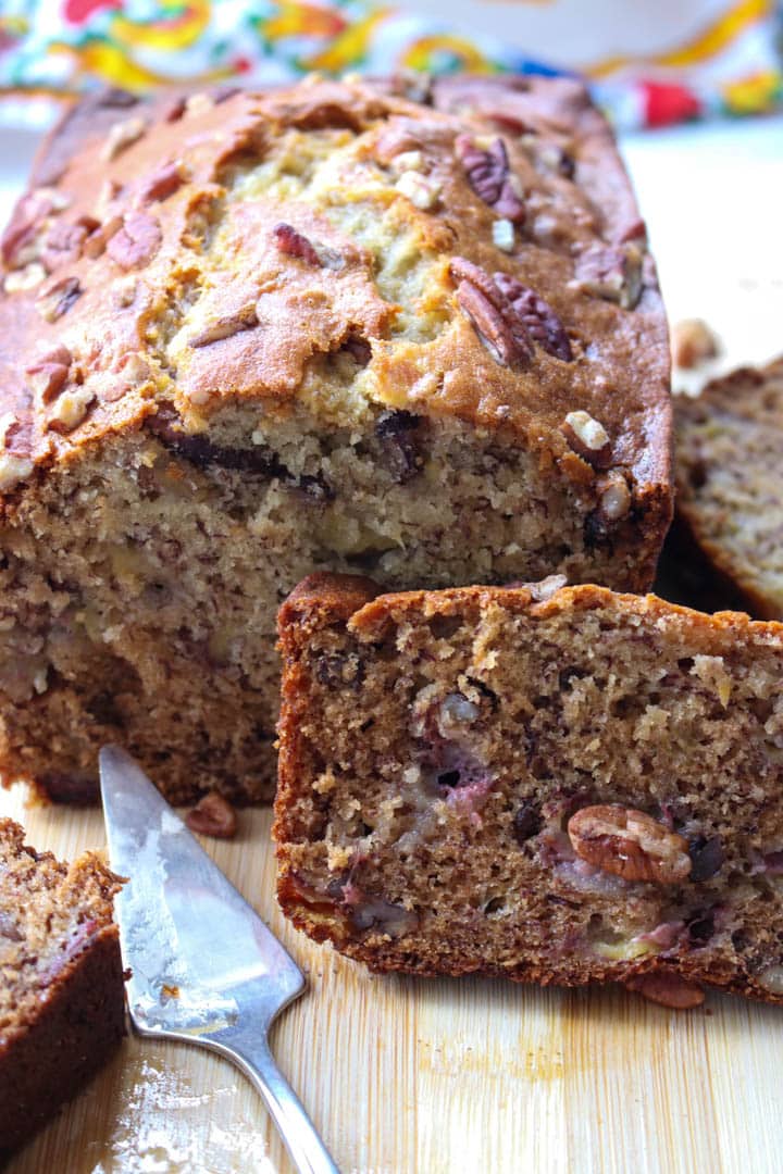 load of banana bread with a slice leaning on it