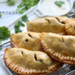 plate of beef curry samosa hand pies