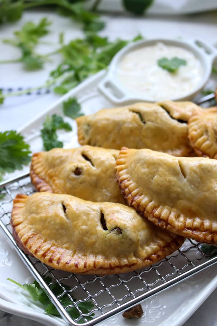 plate of beef curry samosa hand pies