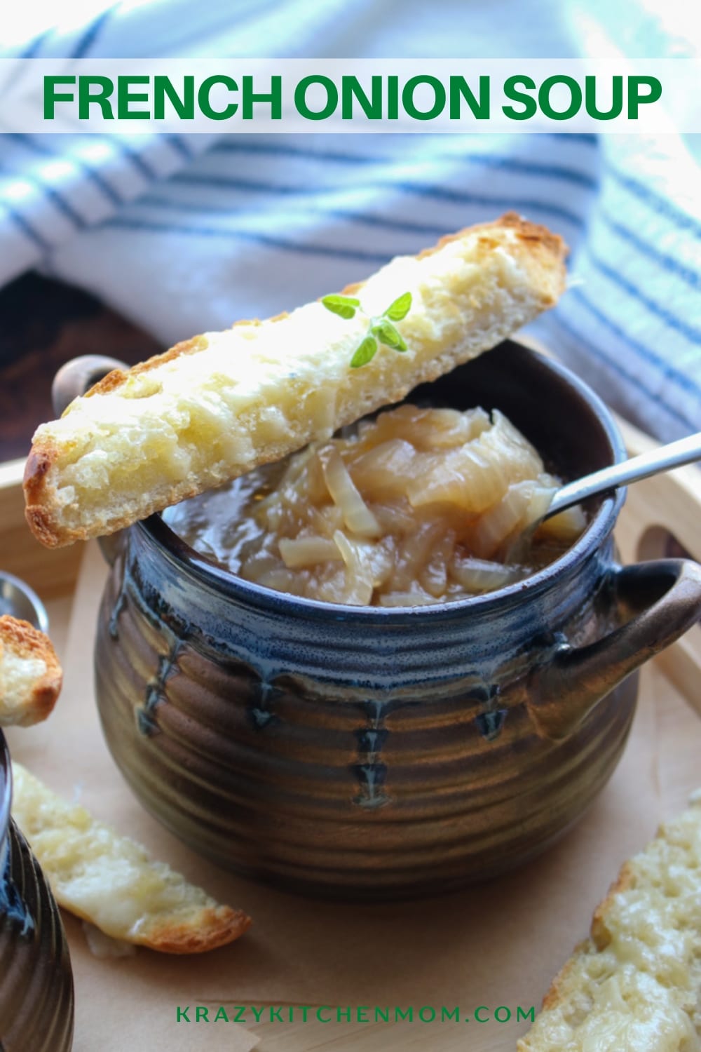 French Onion Soup is a beef-based soup filled with sweet soft cooked onions. It's topped with a cheesy baguette crouton. via @krazykitchenmom