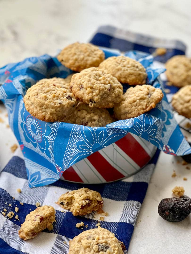 cookie tin filled with oatmeal fig pecan cookies