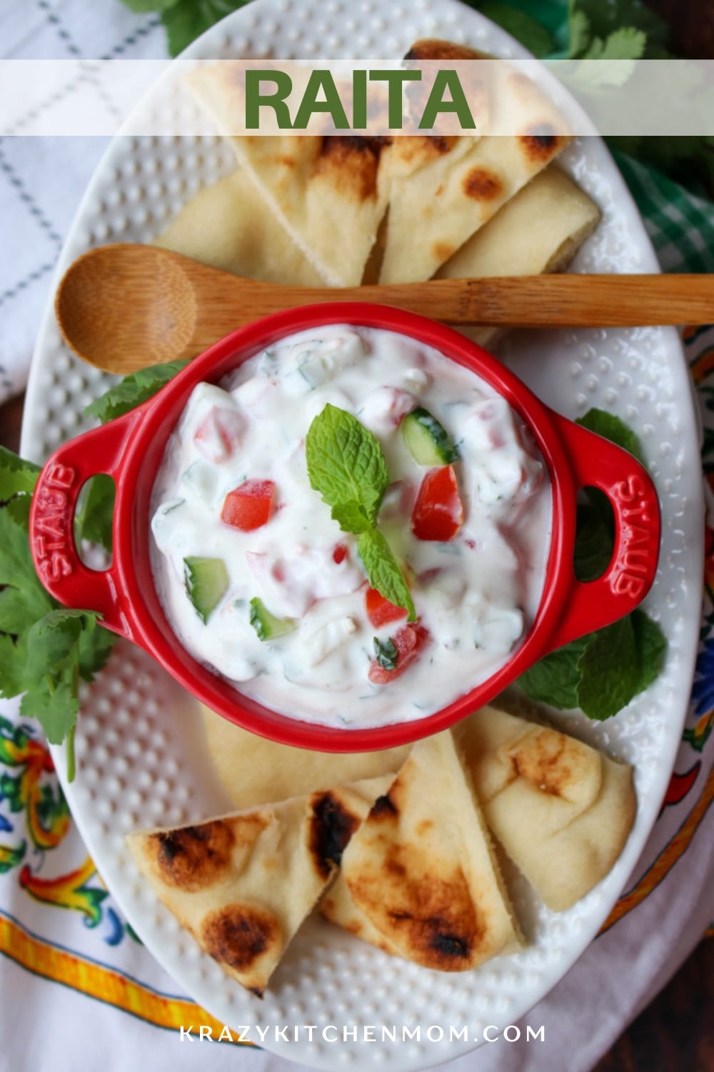 A creamy cool Indian yogurt-based dipping sauce that pairs perfectly with grilled pita bread, fresh veggies dipper, and spicy foods. via @krazykitchenmom