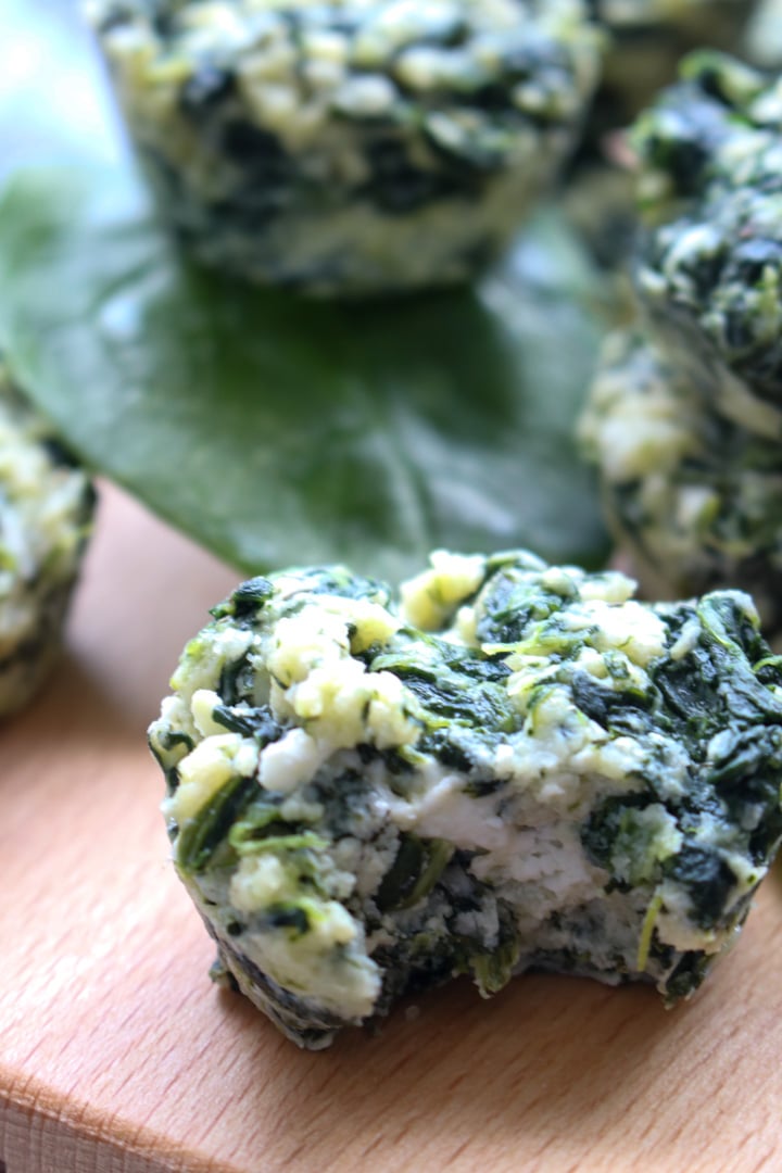 spinach pie bites on a board