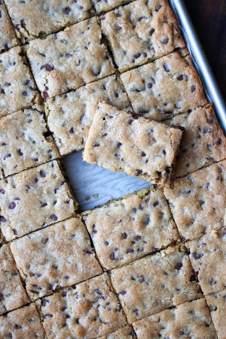 pan of toll house cookie bars with on square bar removed and sitting on top