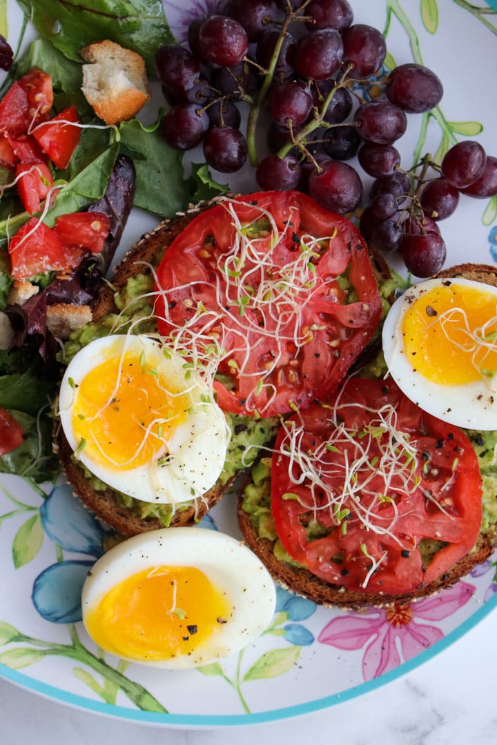 salad with leaf lettuce, ripe tomatoes, and soft boiled eggs