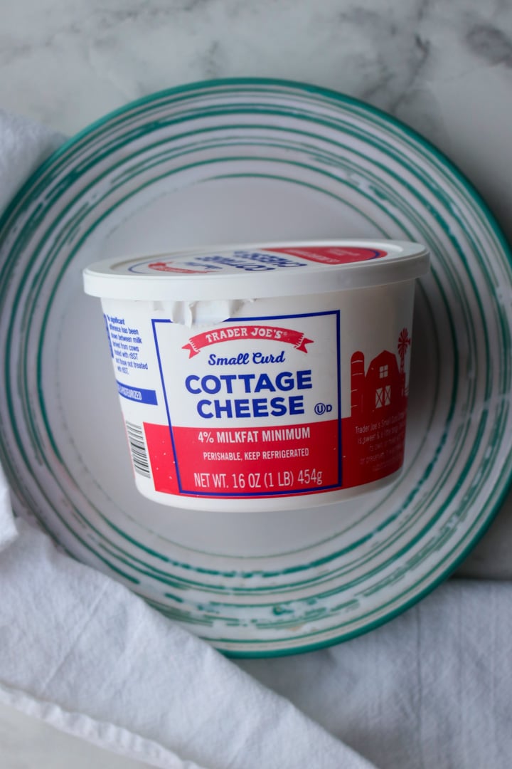 container of cottage cheese on a plate