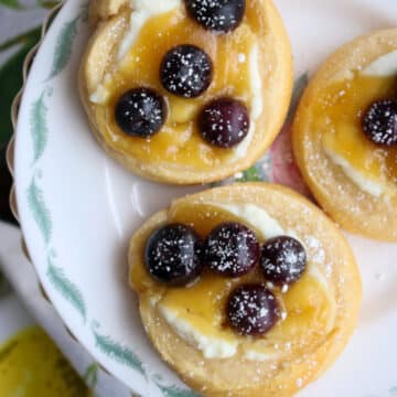 three lemon blueberry danish on a small plate