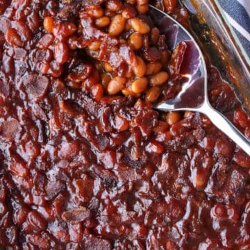 baked beans and a serving spoon in a baking dish