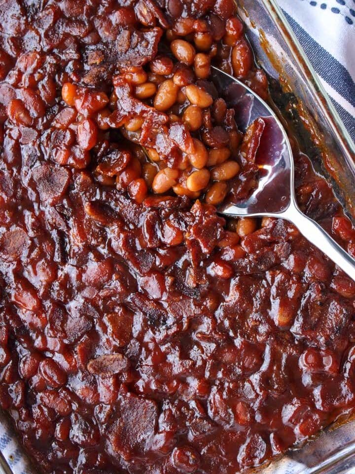baked beans and a serving spoon in a baking dish