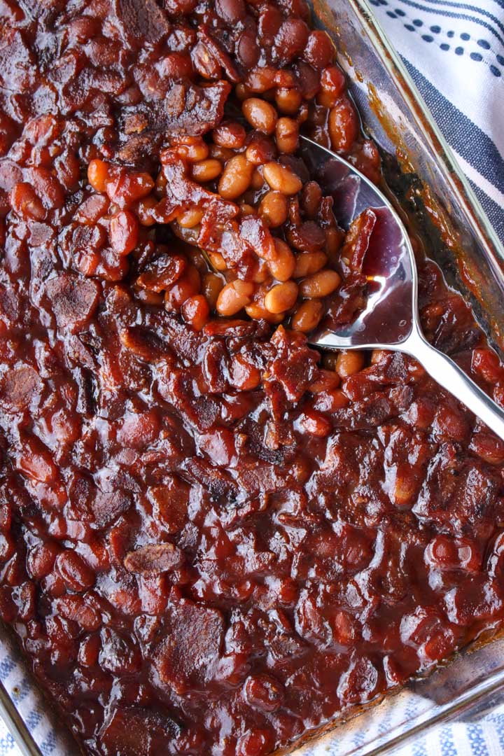baked beans and a serving spoon in a baking dish