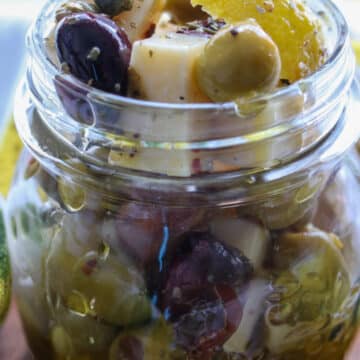 jar of manchego cheese and olives