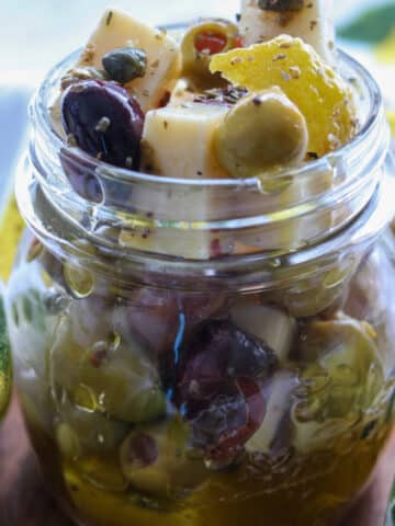 jar of manchego cheese and olives