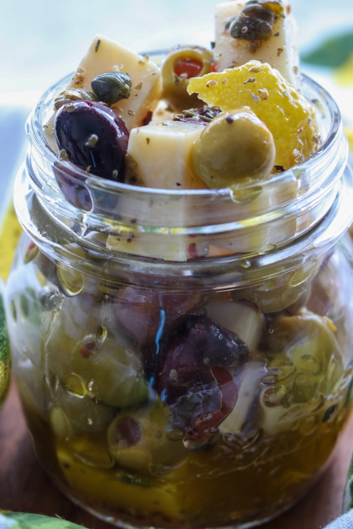jar of manchego cheese and olives