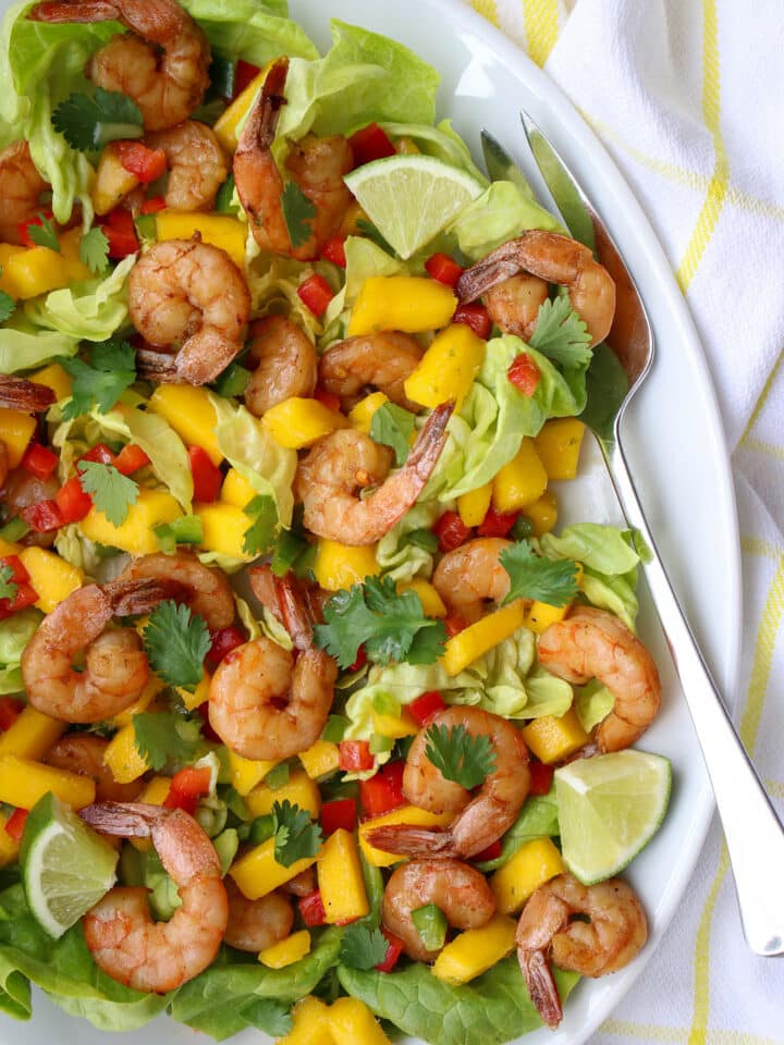 Shrimp and Mango salad on a plate with a large fork