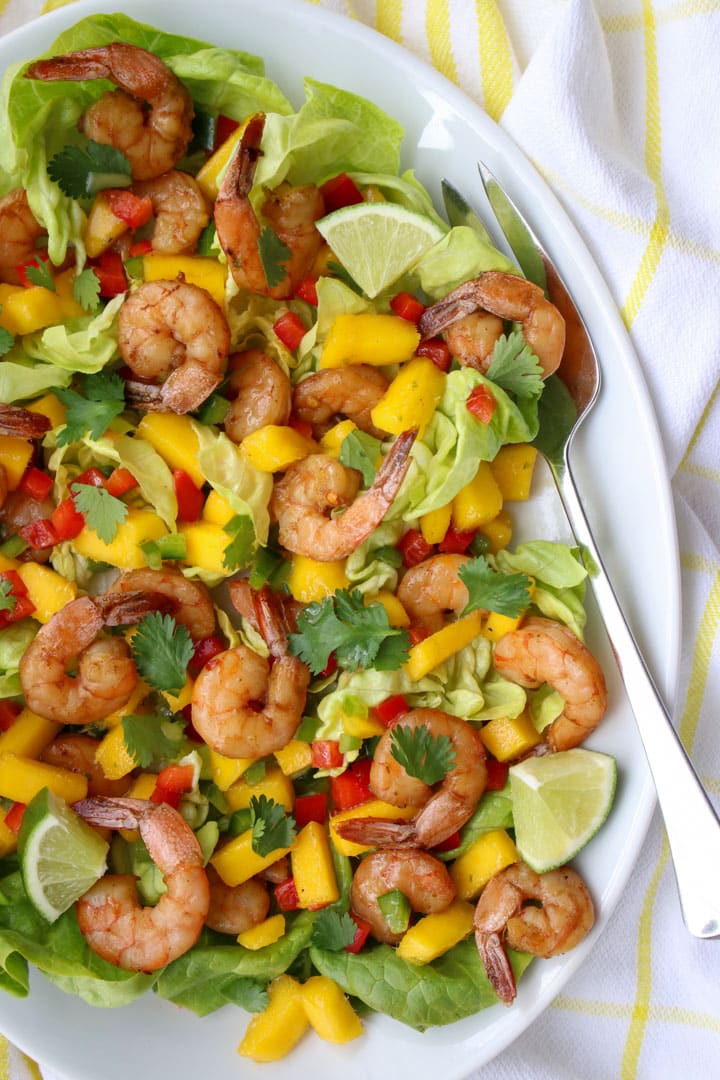 Shrimp and Mango salad on a plate with a large fork