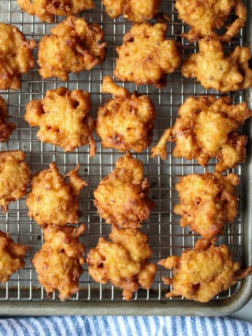 zucchini corn fritters on a cooling rack