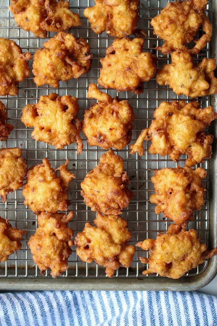 zucchini corn fritters on a cooling rack