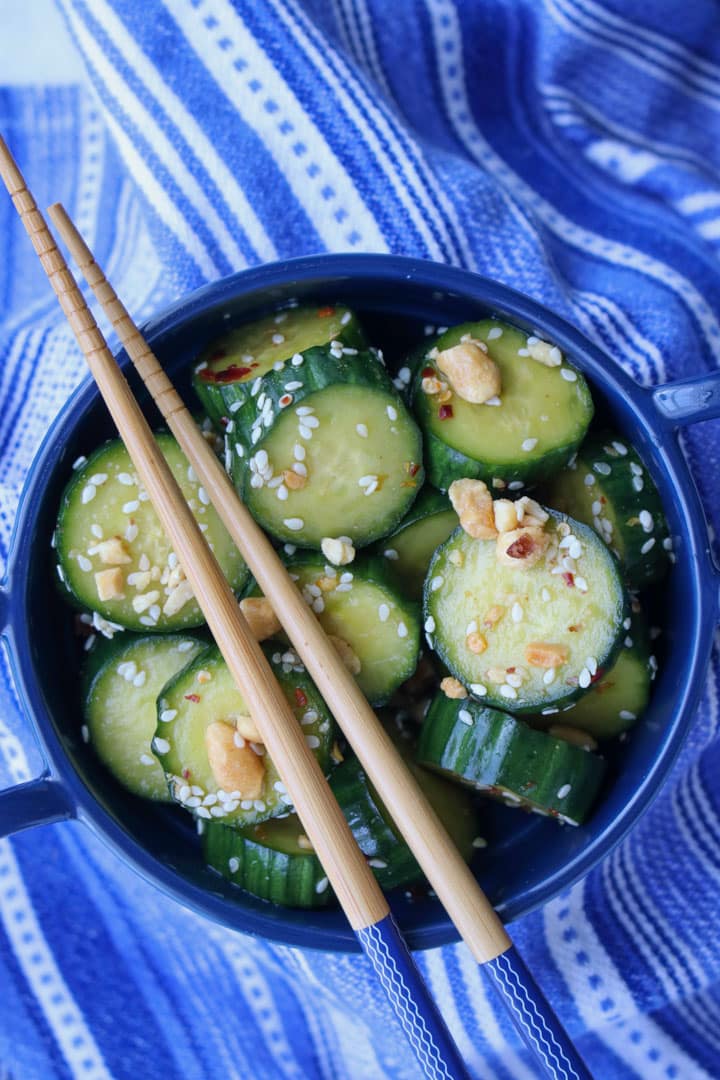 BOWL OF ASIAN STYLE CUCUMBERS WITH CHOP STICKS