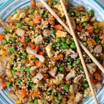 bowl of cauliflower pork fried rice with chop sticks