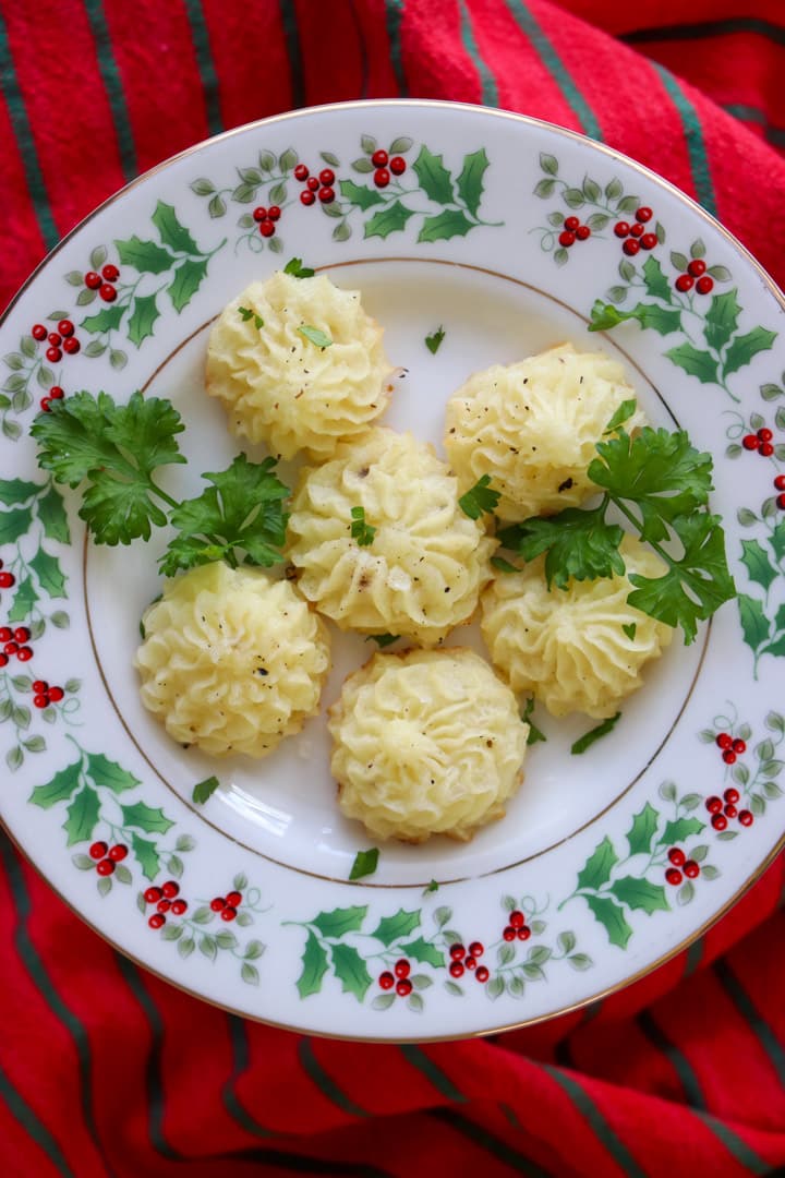 christmas plate with duchess potatoes on it