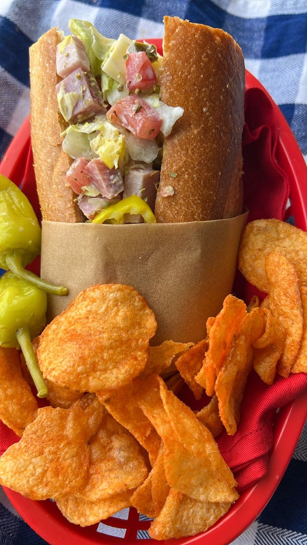 grinder chopped salad on a deli roll with bbq chips