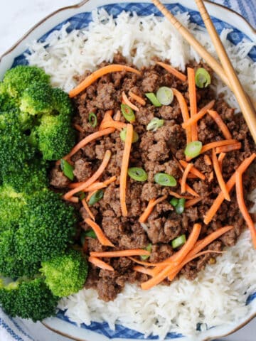 bowl of Korean beef on white rice with a side of broccoli