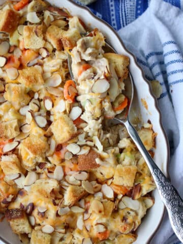 ROTISSERIE CHICKEN SALAD CASSEROLE WITH A SERVING SPOON