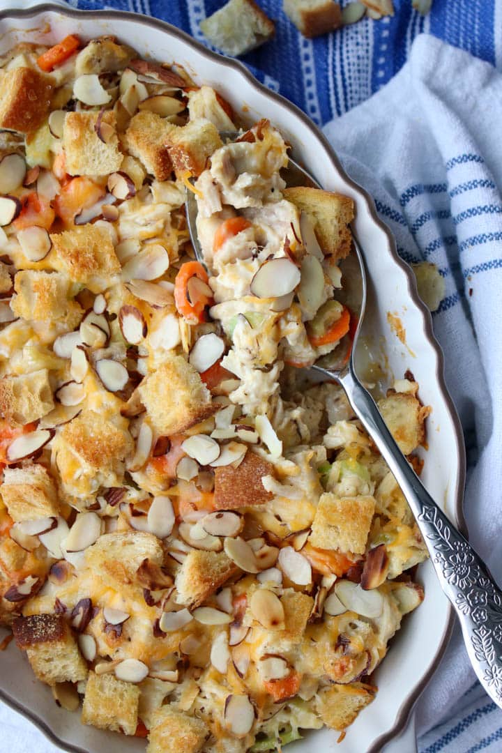 ROTISSERIE CHICKEN SALAD CASSEROLE WITH A SERVING SPOON