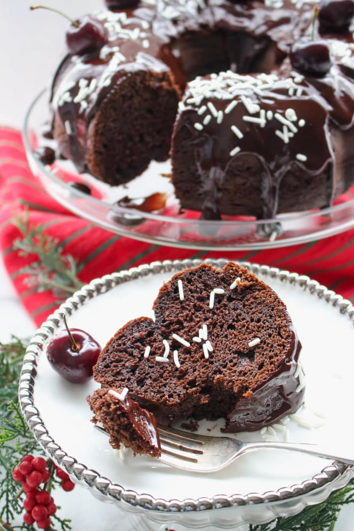 chocolate bundt cake slice in front of whole cake