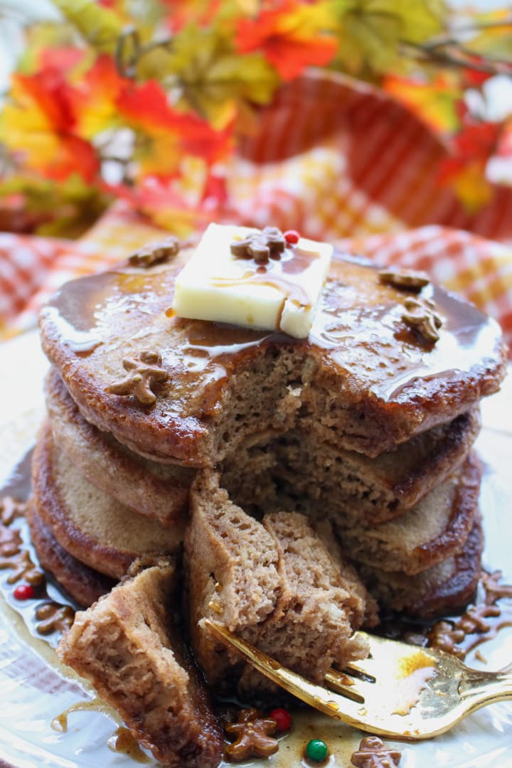 stack of gingerbread pancakes with a fork full cut out
