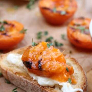 SLICE OF BAGUETTE TOPPED WITH BURRATA AND GRILLED APRICOT