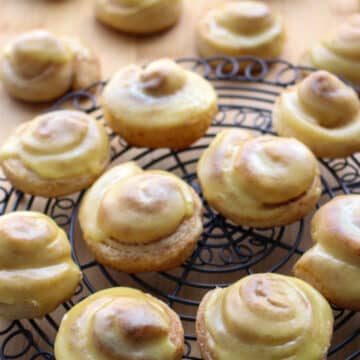 Mini Orange Rolls on a round wire rack