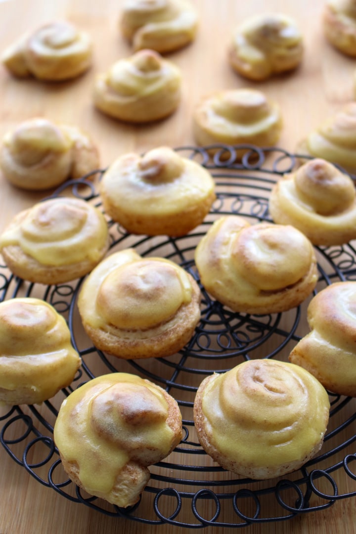 Mini Orange Rolls on a round wire rack