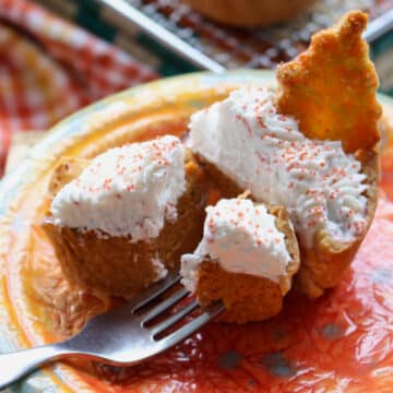 Mini Honey Pumpkin Pie on a plate with a bite on a fork