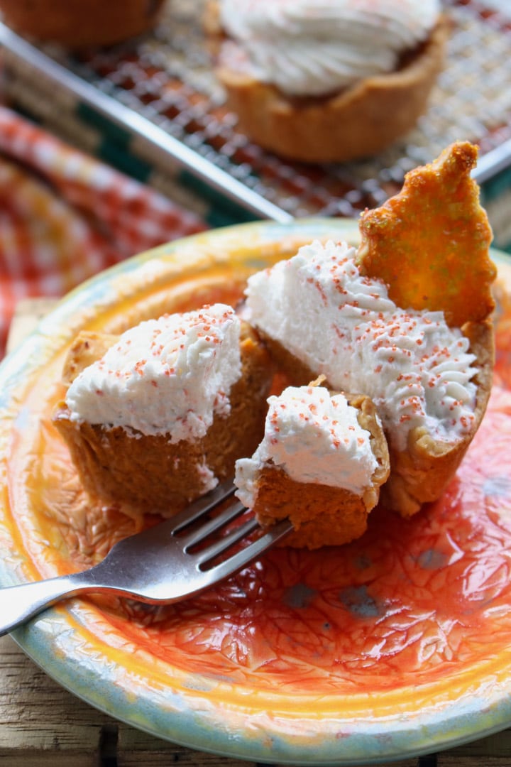 Mini Honey Pumpkin Pie on a plate with a bite on a fork