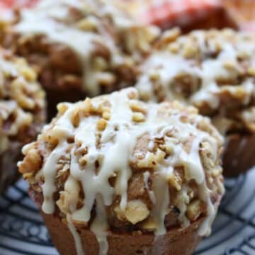 Pumpkin Spice Zucchini Walnut Muffins on a cooling rack