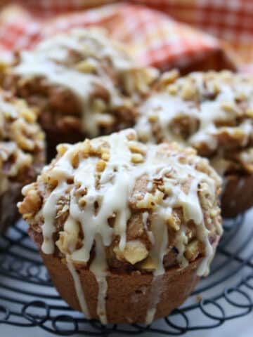 Pumpkin Spice Zucchini Walnut Muffins on a cooling rack