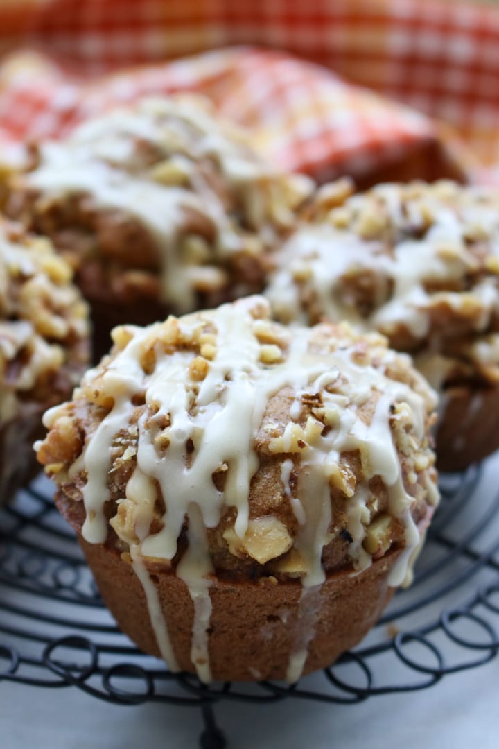 Pumpkin Spice Zucchini Walnut Muffins on a cooling rack