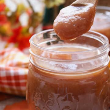 JAR OF APPLE BUTTER WITH A SPOON