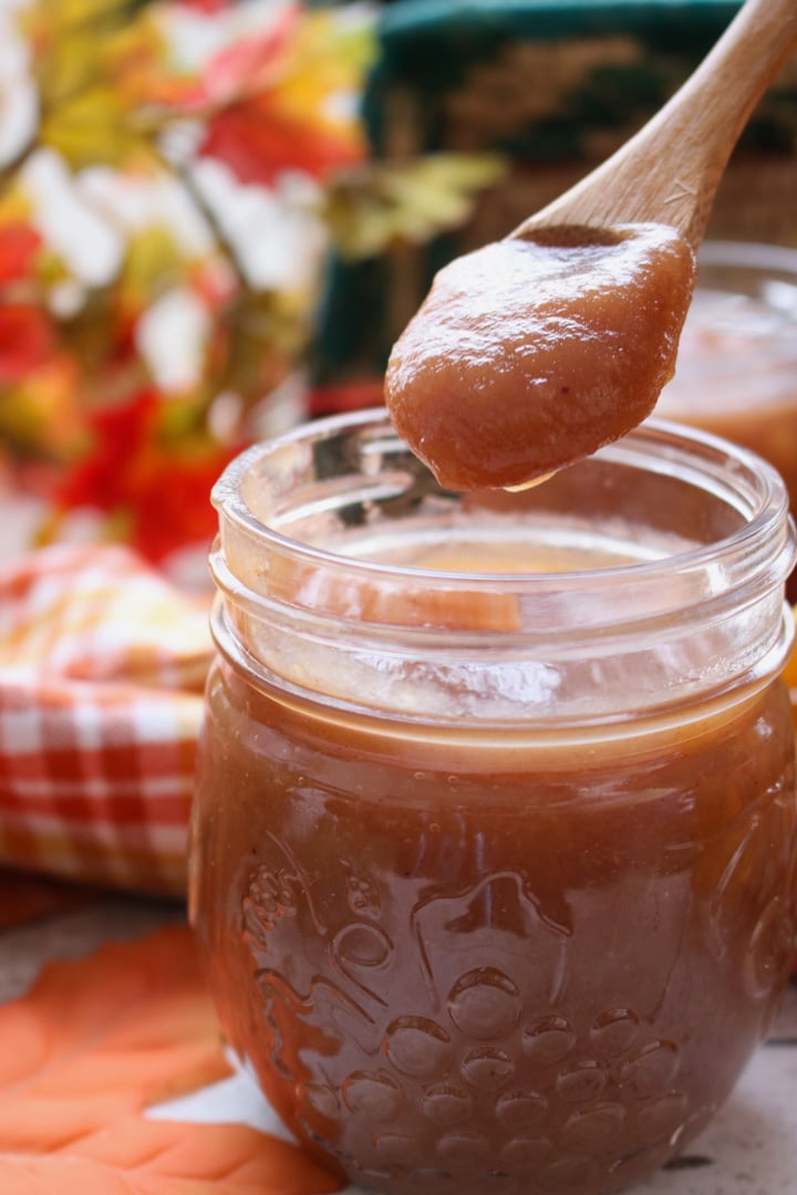 JAR OF APPLE BUTTER WITH A SPOON