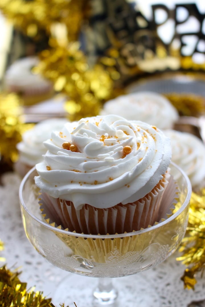 cupcake with icing in a champagne glass