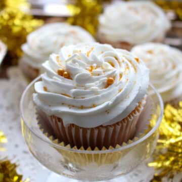 cupcake with icing in a champagne glass