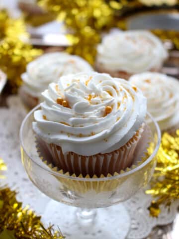 cupcake with icing in a champagne glass